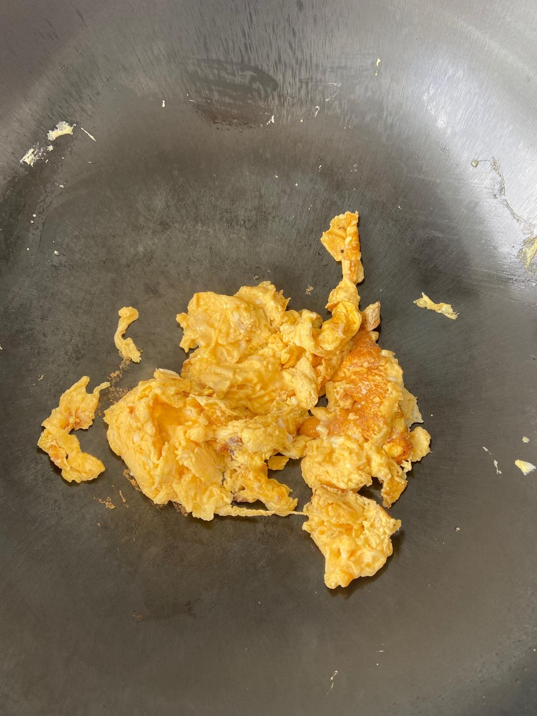 Cook the eggs in the pan until set, then brea