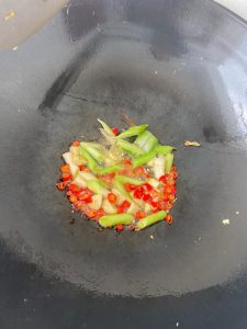 Bloom the garlic and chili