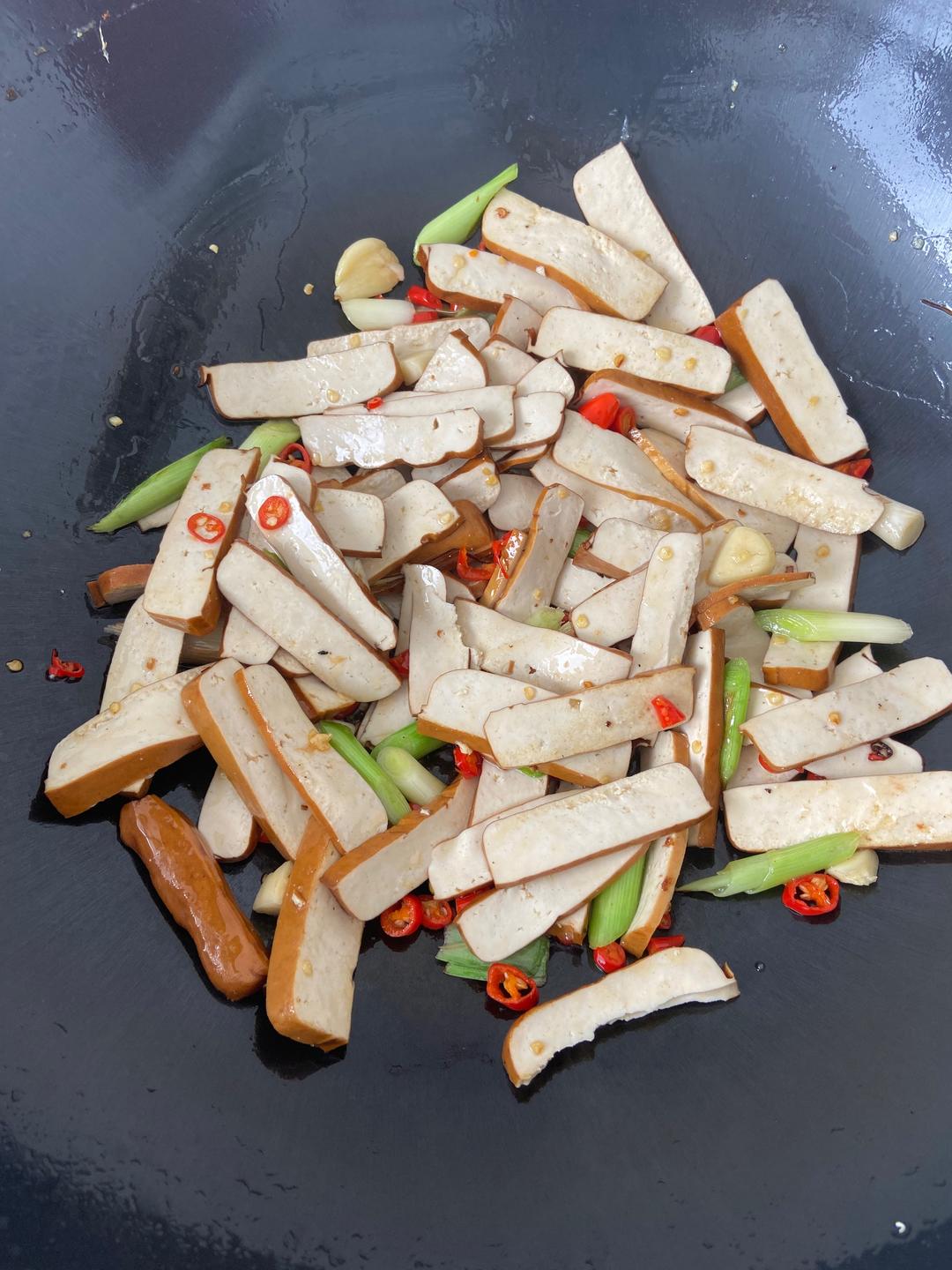 Add the xiang-gan dice and stir-fry 3 minutes