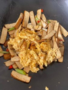 Return the scrambled egg and toss