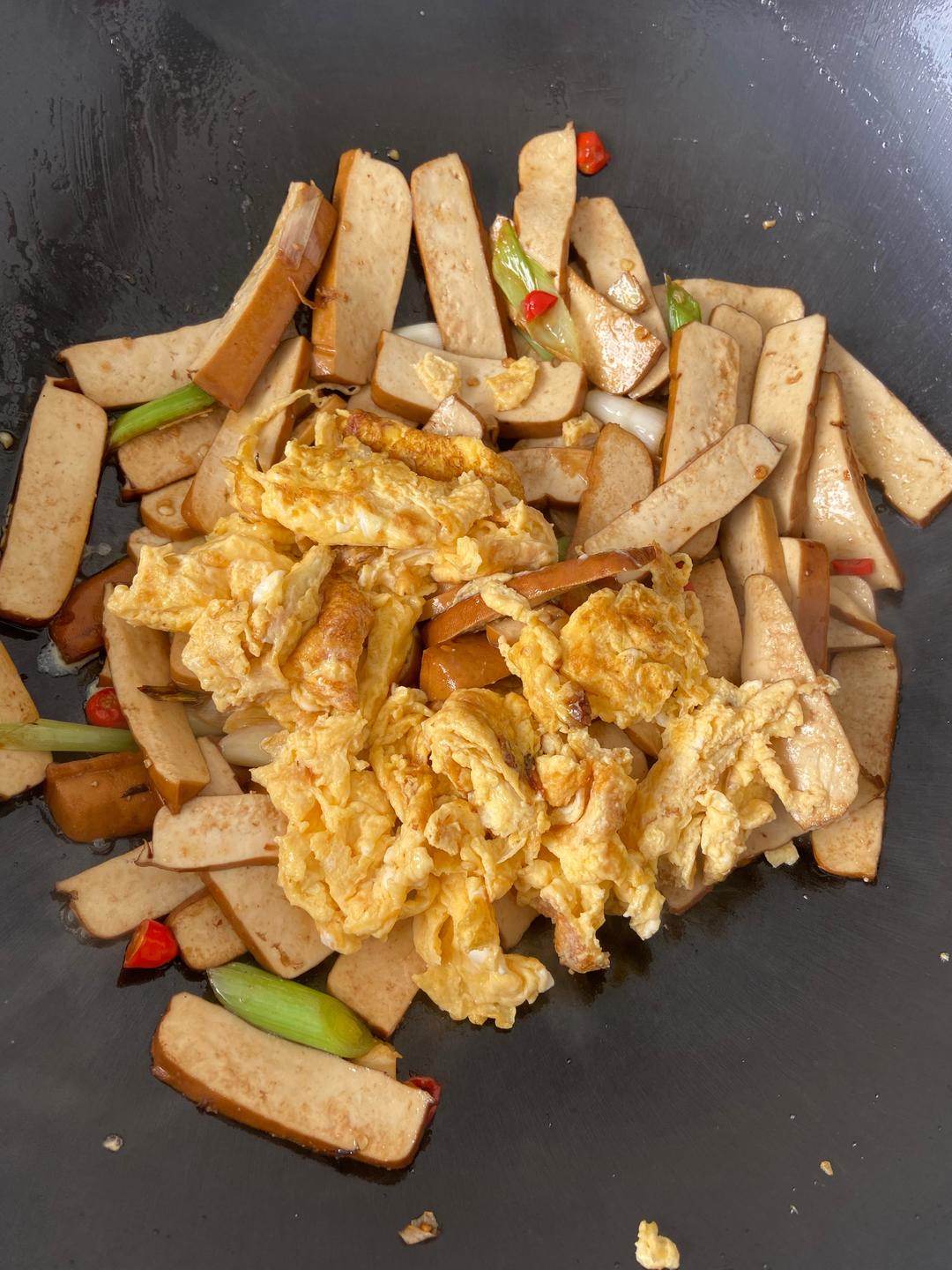 Return the scrambled egg and toss