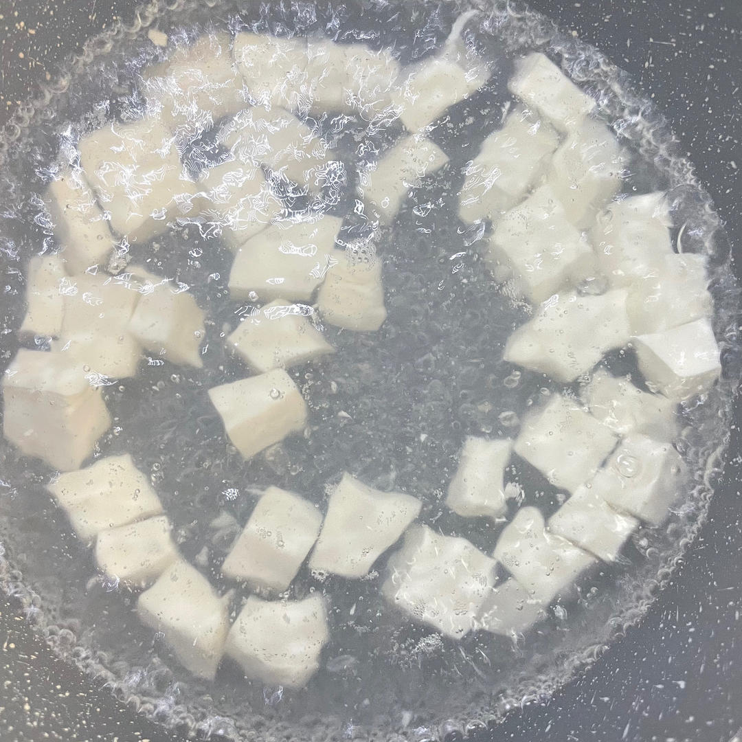 Blanch the tofu cubes for 30 seconds