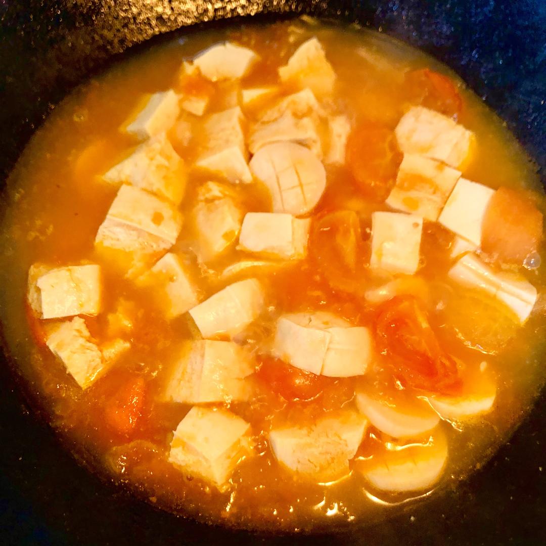 Add the frozen tofu cubes and keep simmering