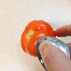 The easy peel: scrape the whole tomato skin w