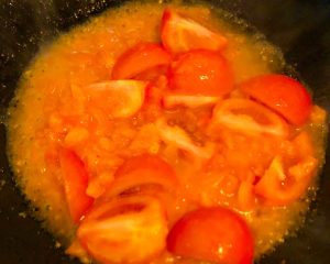 Add the tomato chunks and cook until soft