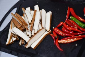 Halve the small chilies lengthwise - it bring
