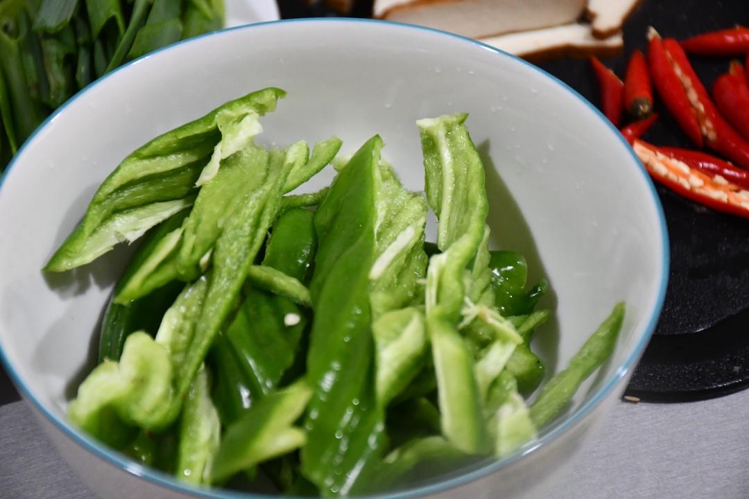 Seed the green peppers and cut them into smal