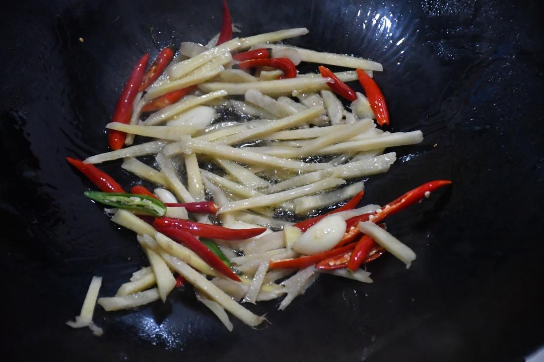 Heat oil and bloom the garlic, pickled ginger