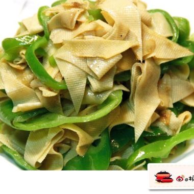 Diamond-cut dried tofu tossed with green chilies in a gloss