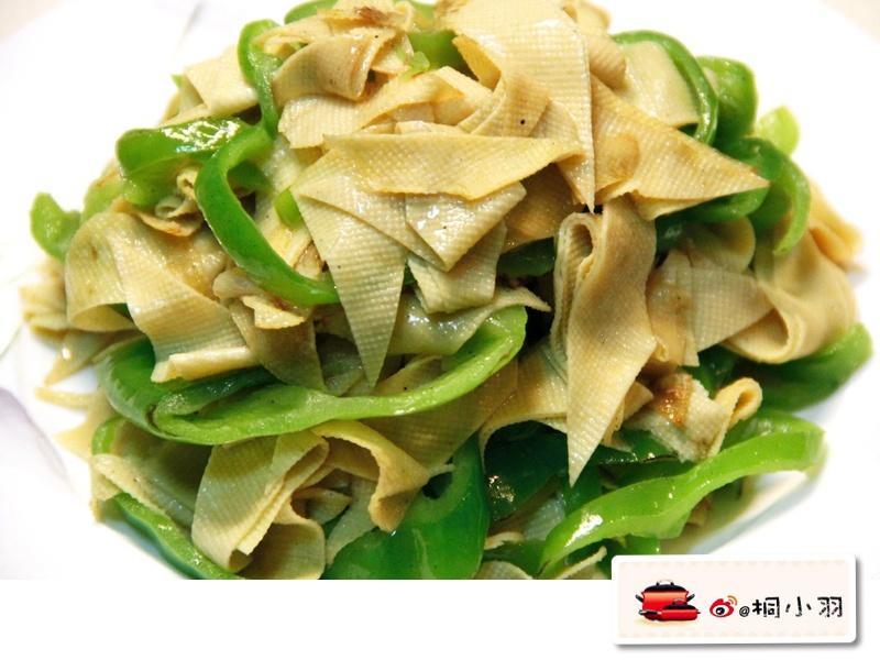 Diamond-cut dried tofu tossed with green chilies in a gloss
