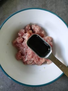 Mince the pork, add a spoon of light soy, and