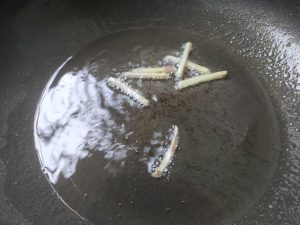 Heat oil in the pot and bloom the ginger slic