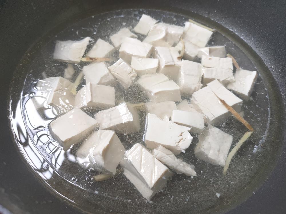 Add water and the tofu; simmer 10 minutes