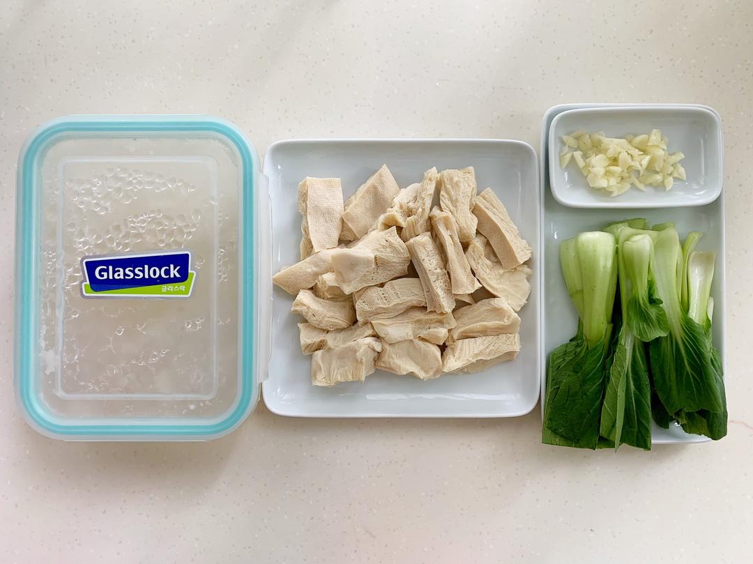 Prep: thawed frozen tofu, greens, minced garl