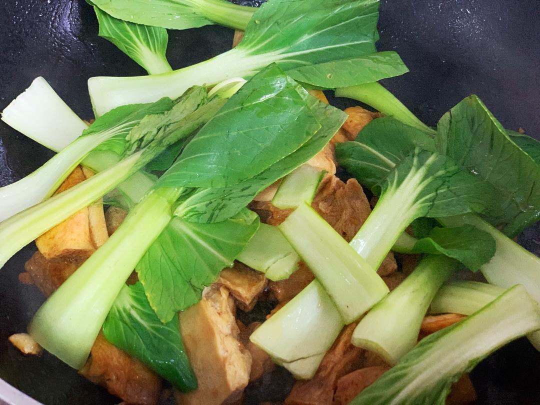 Add the greens and toss a few times