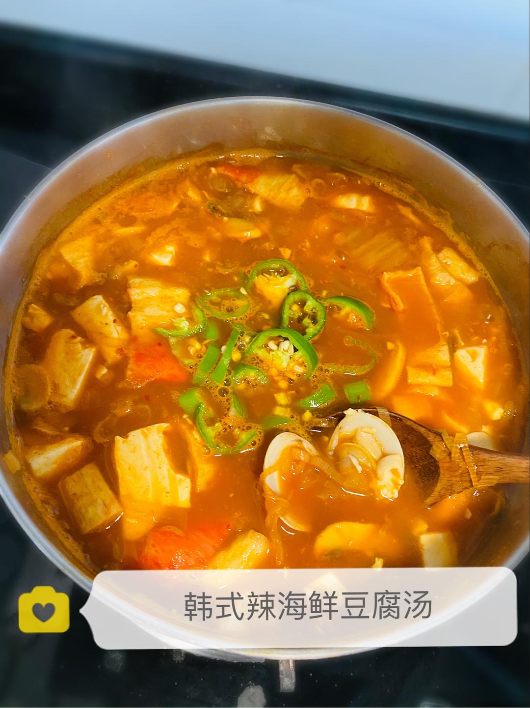 Red Korean seafood soup with silken tofu and clams
