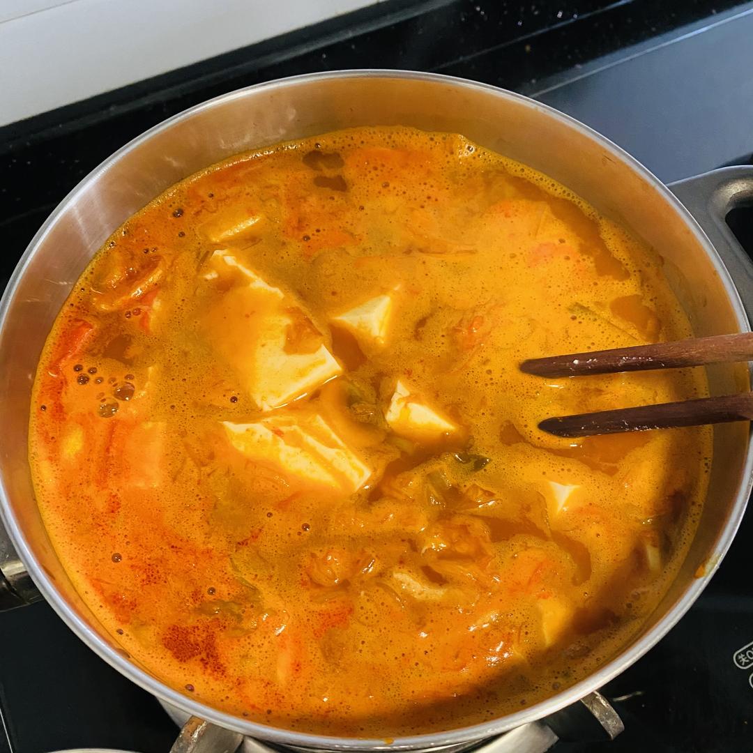 Once it boils, add the cubed tofu