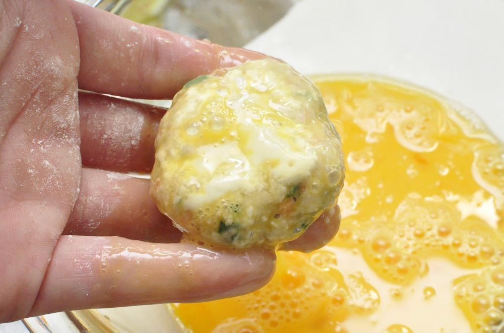 Beat the eggs and coat each patty evenly in t