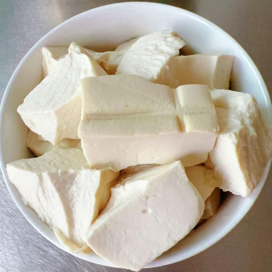 Tear the tofu into large pieces by hand