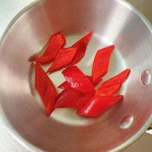 Cut the colored pepper into small pieces