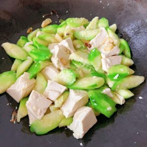 Add the tofu, toss or push a few times, add a