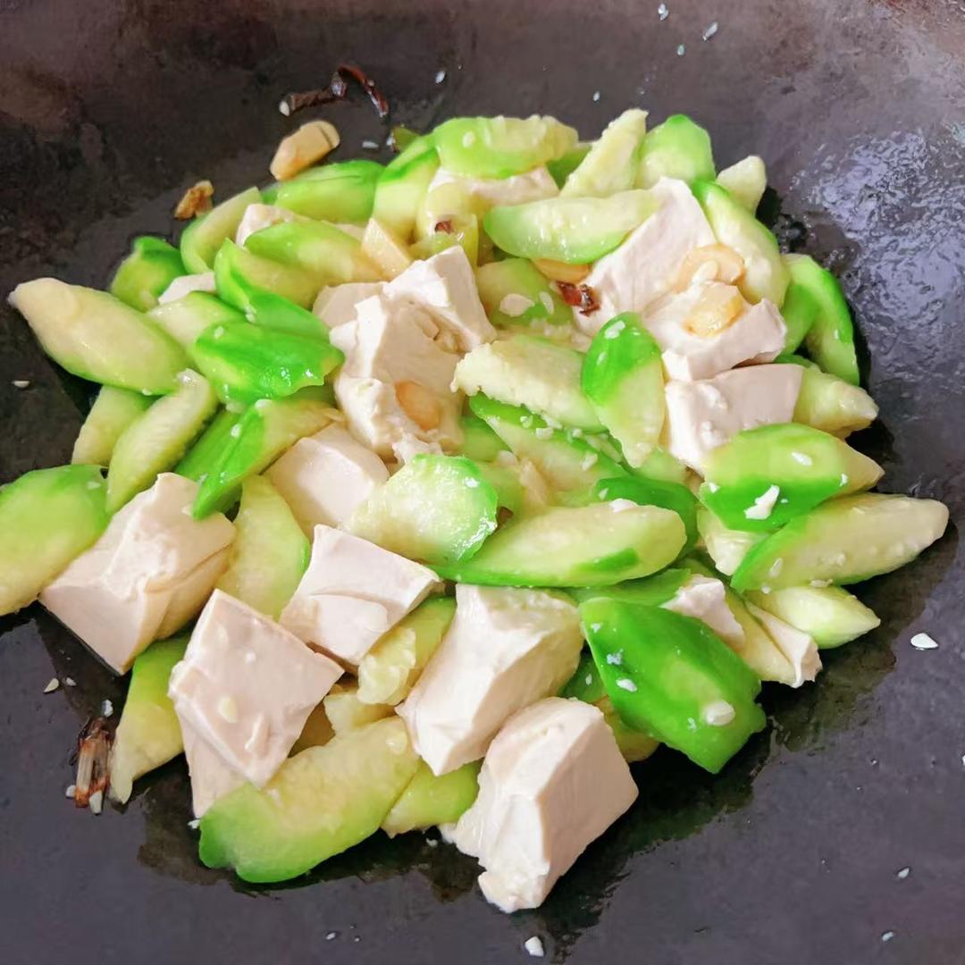 Add the tofu, toss or push a few times, add a