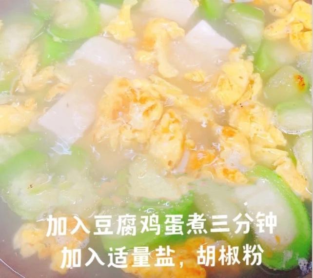 Add the tofu and eggs, simmer 3 minutes, and