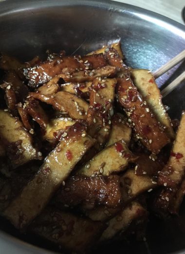 Mala-coated smoked dougan slices