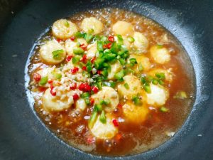Add the minced chilies and garlic
