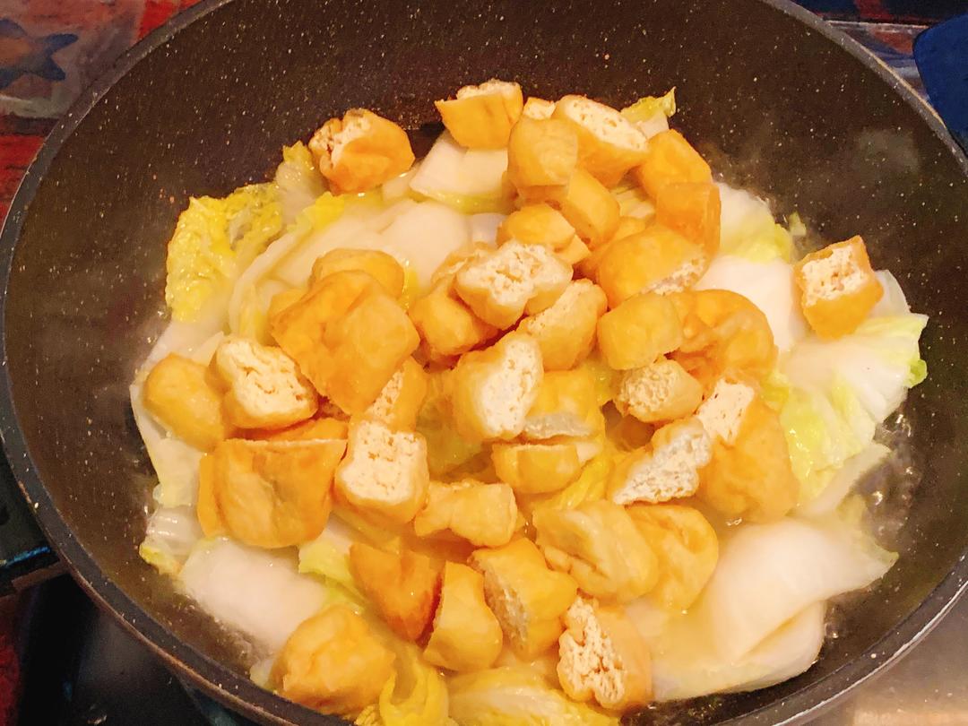 Add the halved tofu puffs