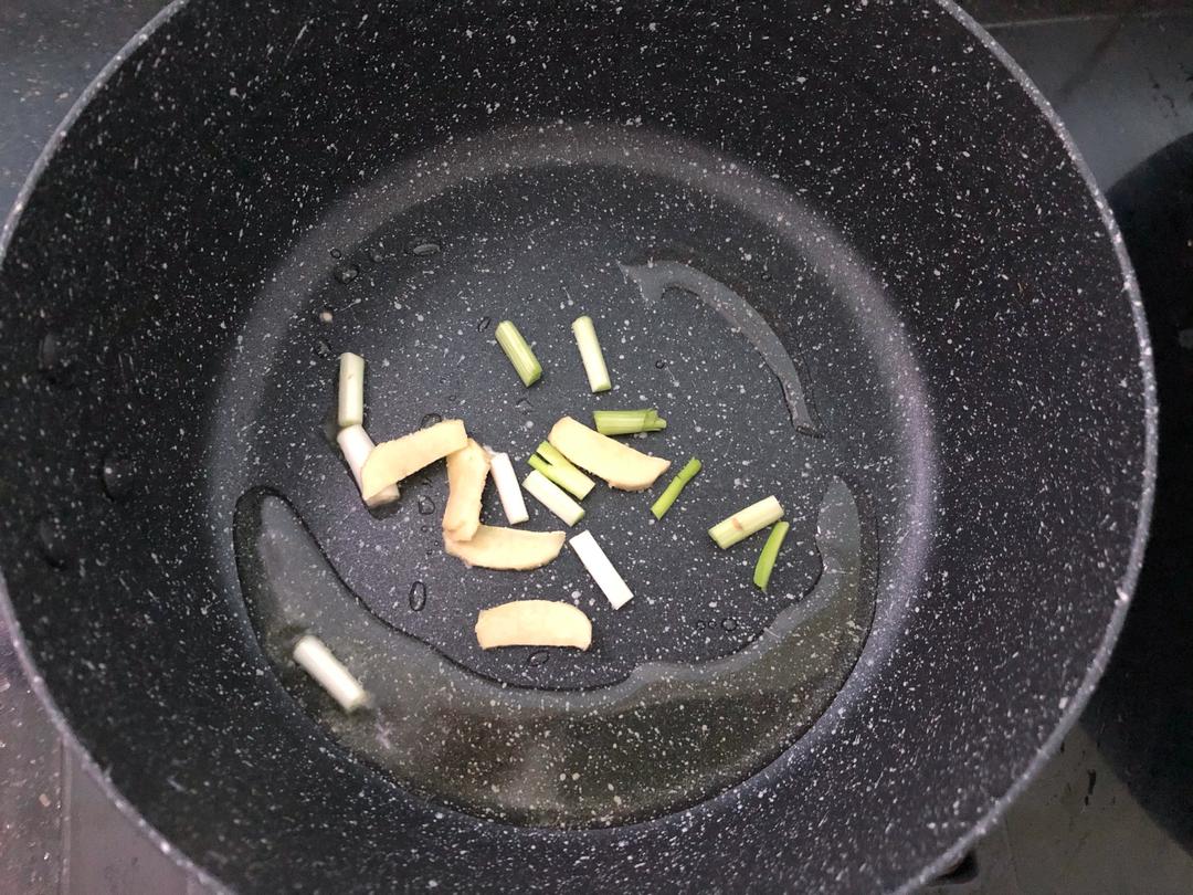 Bloom the scallion, ginger, and garlic in hot