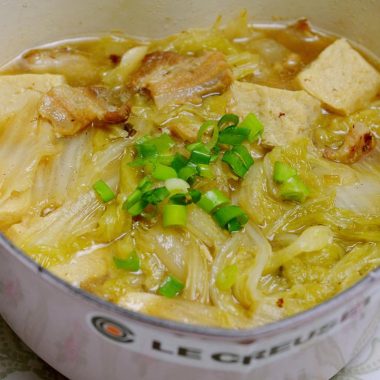 Napa and pork belly stewed with frozen tofu in broth