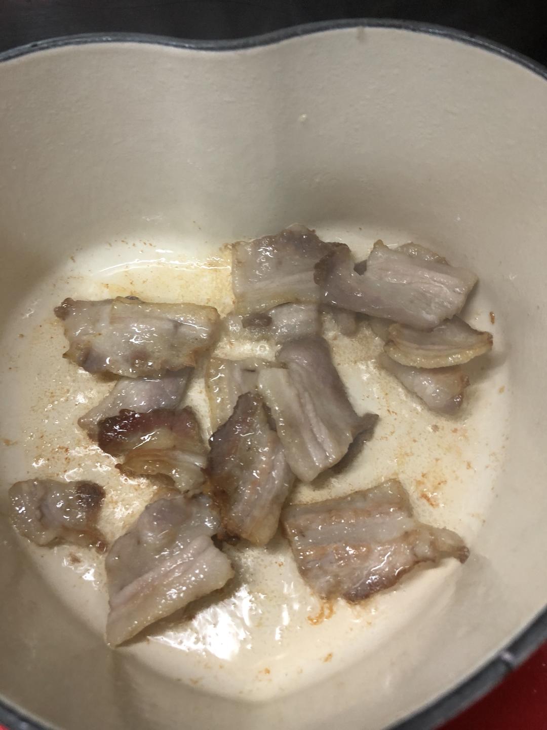 Heat oil in the pot and render the pork belly