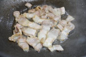 Heat the pan with oil and render the pork ove