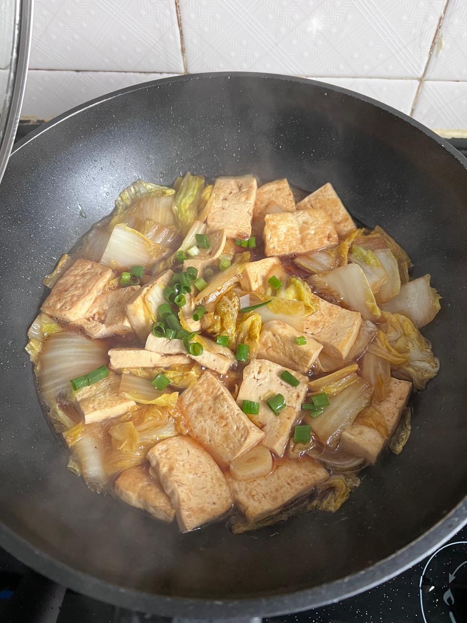 Golden tofu braised with soft cabbage in a soy sauce
