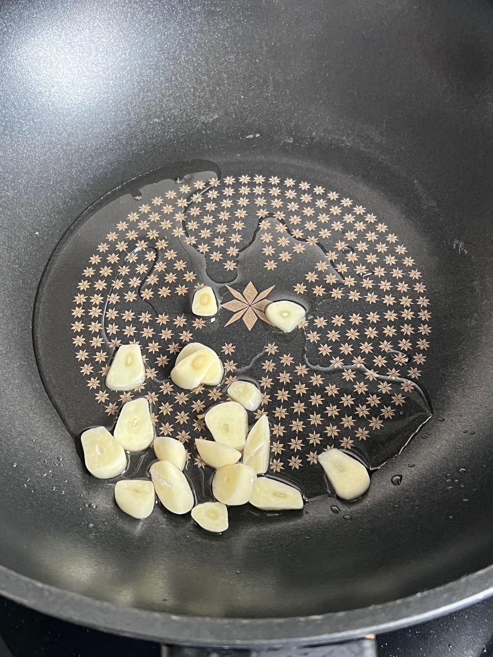 Add a little oil and bloom the garlic