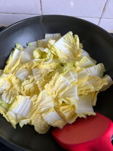 Add the cabbage and stir-fry until soft