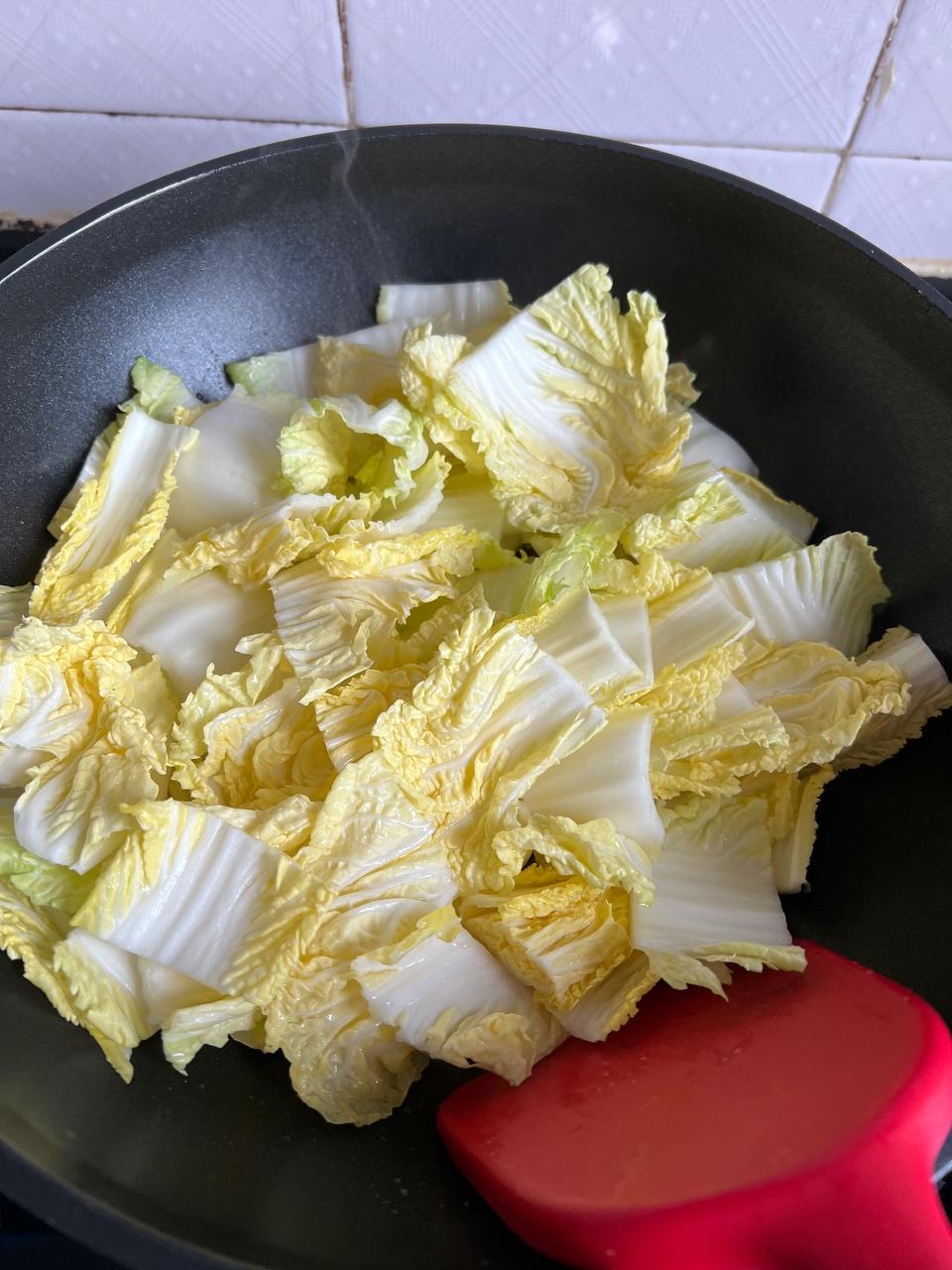 Add the cabbage and stir-fry until soft; seas