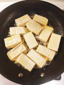 Heat oil in the skillet and lay the coated to