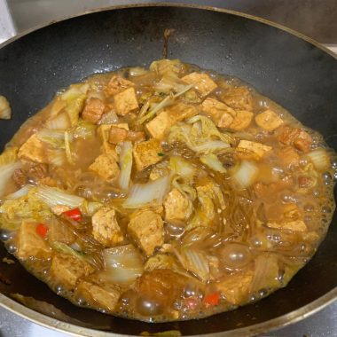 Pork, cabbage, noodles, and tofu braised in one pot