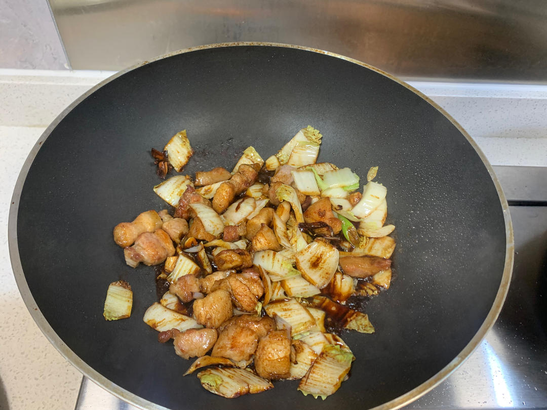Add the cabbage cores and stir-fry with light