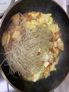 Add the cabbage leaves, sweet-potato noodles,