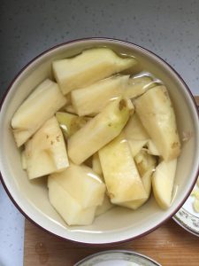 Peel the potato and cut it into thumb-sized p