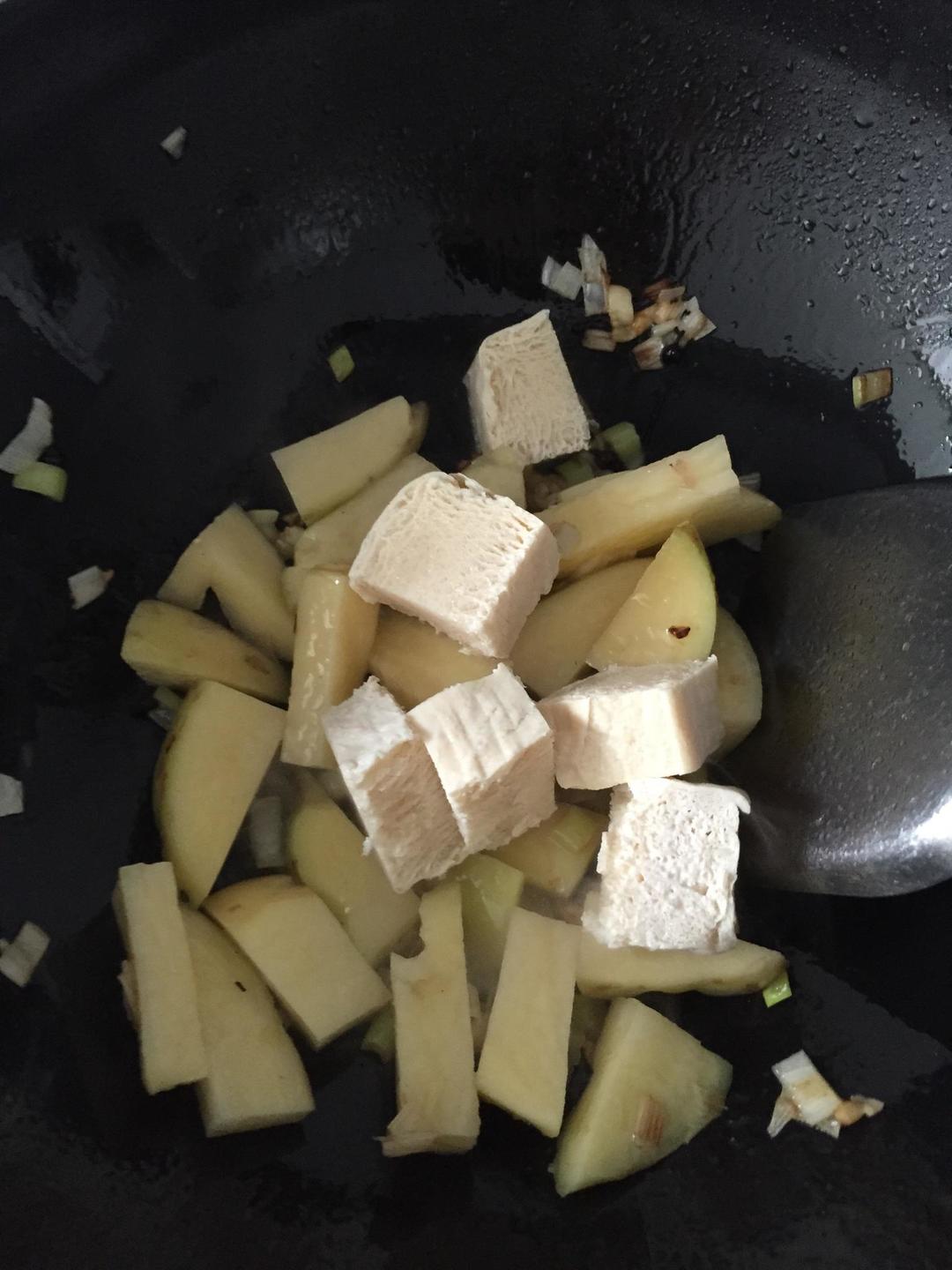 Once fragrant, add the potato and frozen tofu