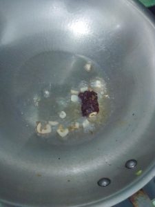 Heat oil, add the garlic and the doubanjiang