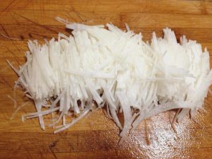 Cut the radish into fine shreds - the thinner