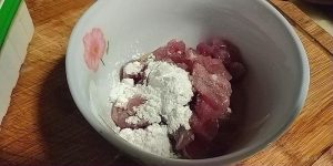 Season the pork with white pepper, salt, and