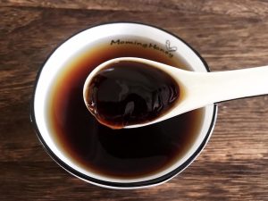 In a bowl of water: two spoons of light soy,