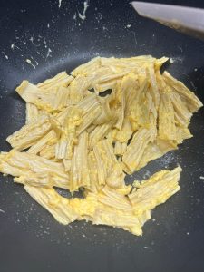 Heat oil, toss the yuba in the pan for a mome