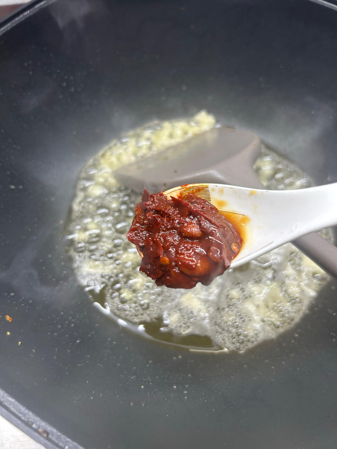 In the pan again, add the garlic and the doub